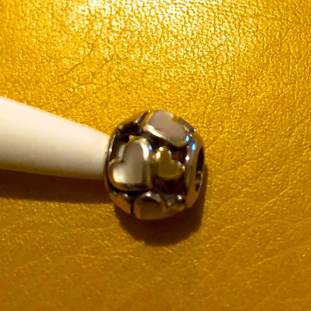 Pandora hearts all over charm with one gold heart